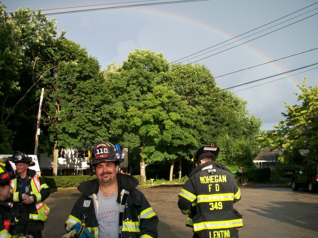 Rob Smiles With Rainbow Over His Head At HAZMAT Incident