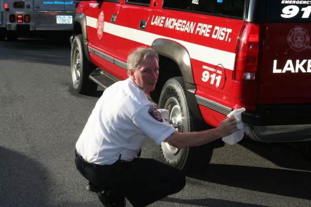 Chief Boddie Puts the Finishing Touches on the Chief's Car Before the Yorktown Parade