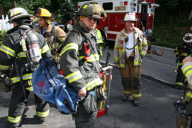 Firefighter  Gravius Carrying Some of the FASTeam Equipment