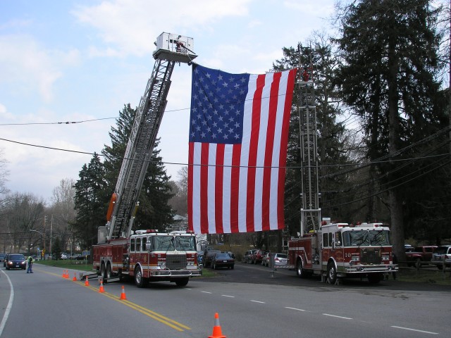 Peekskill Tower Ladder 45 & Mohegan Ladder 10 Holding The American Flag Over Oregon Rd For A Special Ceremony