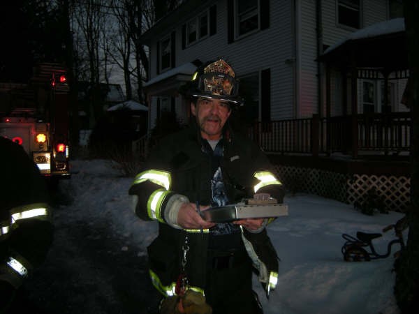 Deputy Chief Billy Hecker Smiles After Finishing Up Paperwork