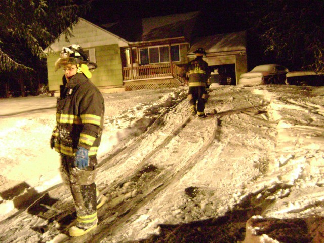 FF's Pack Up Hose After Structure Fire During Snowstorm On 12/19/08