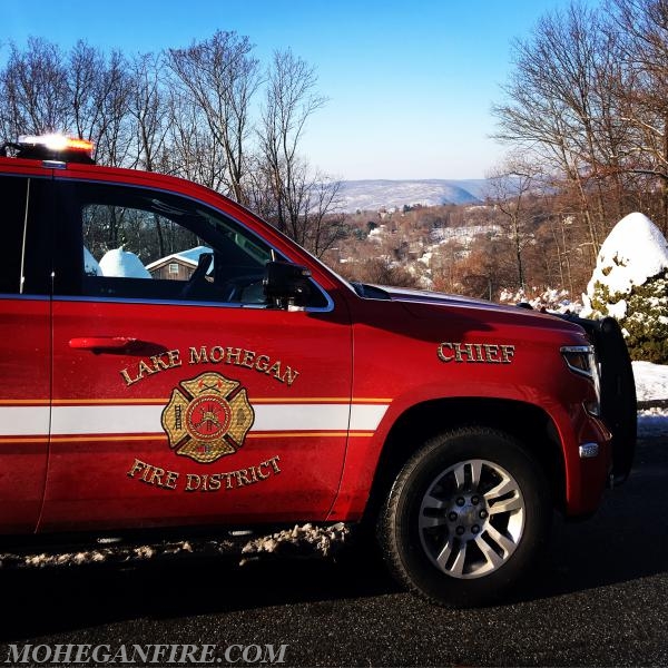 Car 2263 on top of Forest Ave during Candy Cane Run with snowy Bear Mountain in distance 