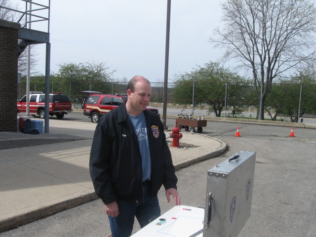 Firefighter Calore observes the ICS Board