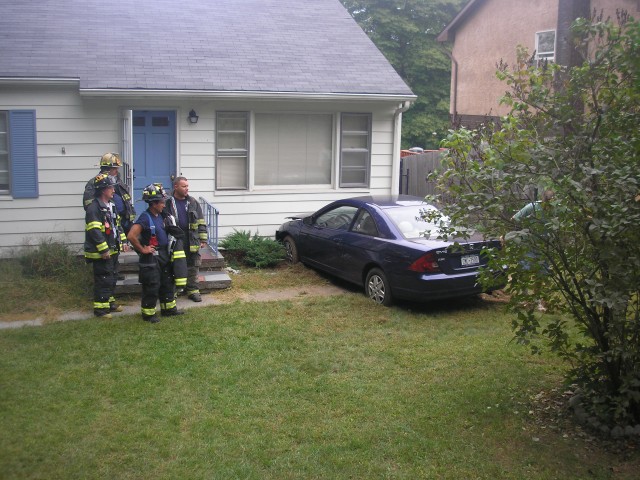 Firefighters Standby At Car Into A House MVA on 9/22/07