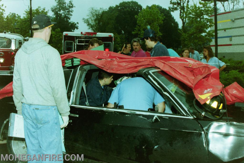 Members extricate a patient from a motor vehicle accident in the Toy's R Us parking lot on Bank Road.