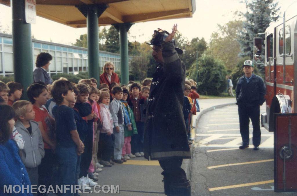 Then firefighter Don McCoskey now Deputy Chief Conducting fire prevention at a school in the district. Photo by Joe Ellman