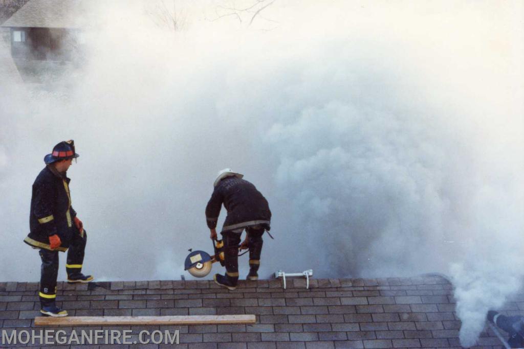 Structure fire Jefferson Village December 1978. Members venting the roof